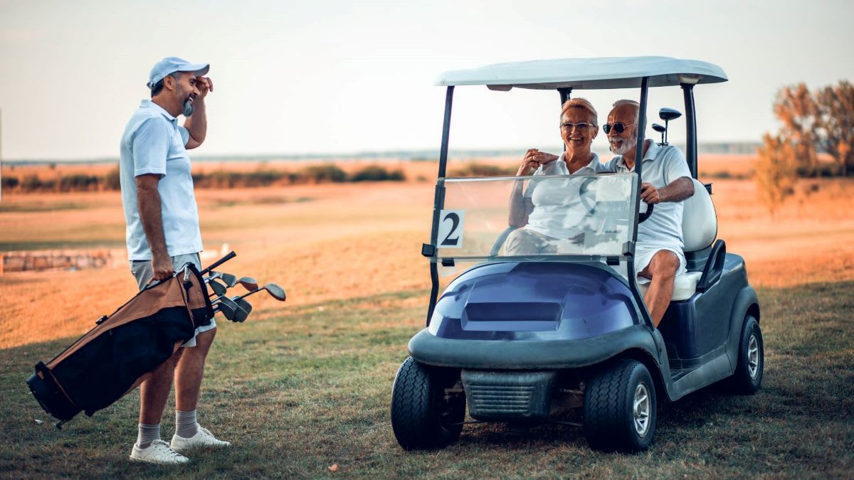 Three senior golfers talking